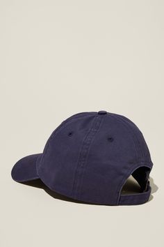 a blue baseball cap with the visor pulled up to show it's peak