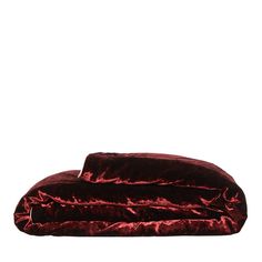 a red velvet pillow on a white background