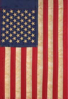 an american flag quilted on the back of a bed sheet with red, white and blue stripes