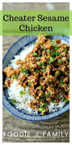 a blue plate topped with meat and rice on top of a wooden table next to a green