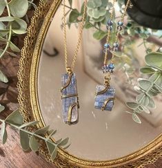 - Elegantly wrapped blue kyanite pendants that can be layered with other necklaces or worn as a statement piece - Gold colored, iron-free chain and lightweight pendants - Prices based on cost of materials and time spent hand-crafting each piece  Variations: - Pendent shape: (1) Square (0.6in) or (2) Long (0.6 x 2 in) Blue Wire Wrapped Crystal Necklace For Healing, Kyanite Jewelry, Agate Earrings, Glass Slipper, Agate Jewelry, Blue Kyanite, Dangly Earrings, Jewelry Inspo, Necklace Gold