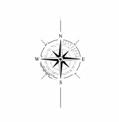 a black and white compass on a gray background