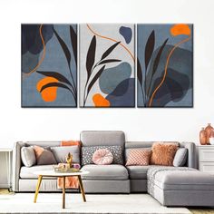 a living room with two paintings on the wall