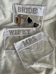 "pre-made, ships next business day! ITEM DESCRIPTION *This listing includes (one) clear makeup/accessory pouch with Pearl letters and a gold zipper DIMENSIONS *Large Size: 11.5\" x 8.5\"  If you are interested in a custom pouch with a different word please message me! (6 letter maximum)" Bride Sunglasses, Bride Slippers, Clear Pouch, Clear Makeup, Pearl Letters, Letter Earrings, Pearl Bride, Initial Earrings, Wedding Gift Boxes