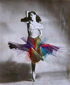 a woman in a colorful dress is dancing