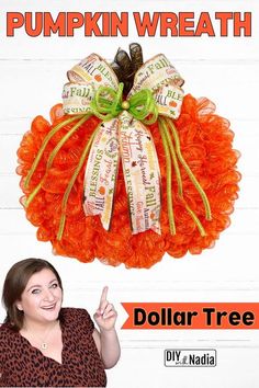 there is a pumpkin wreath with words on it and a woman pointing to the side