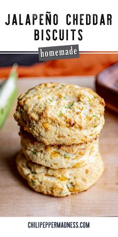 three homemade jalapeno cheddar biscuits stacked on top of each other