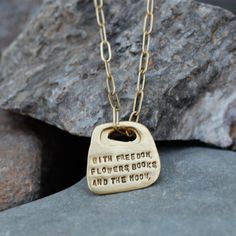 This quote necklace bears the words of Oscar Wilde: “With freedom, flowers, books, and the moon, who could not be perfectly happy?” Part of our Rune Collection, these pendants are hand sculpted with an organic shape reminiscent of runes and tablets. Hung on a medium weight clip chain in your length of choice. In 1895, Oscar Wilde was imprisoned for acts of gross indecency with other men because of his relationship with Lord Alfred Douglas. In 1897, he wrote a letter to his former lover. This let Alfred Douglas, Lord Alfred Douglas, Earrings Quotes, Quote Necklace, Bracelet Quotes, Necklace Quotes, Jewelry Quotes, Oscar Wilde, Gifts Cards