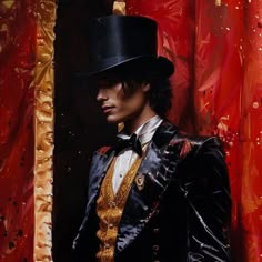 a man wearing a top hat and black jacket with gold trims standing in front of a red curtain