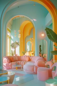 a living room filled with lots of pink couches next to a tall plant in the corner