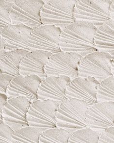 an image of white sand textured with waves and lines on it's surface