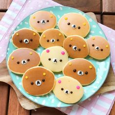 a plate with some cookies shaped like bears on it