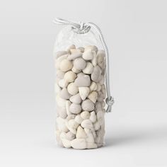 a bag filled with white rocks sitting on top of a table