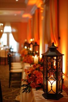 a table with candles and flowers on it