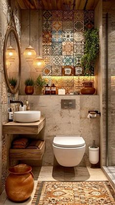 a bathroom with a toilet, sink and mirror on the wall next to a rug