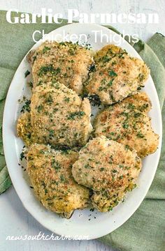 garlic parmesan chicken thighs on a white plate