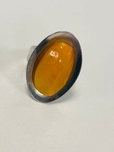 This modernist ring is set with an egg yolk amber stone. A beautiful vintage piece of Jewellery, a real statement piece. In great vintage condition.  This is adjustable Modernist Ring, Amber Ring, Amber Stone, Amber Jewelry, Vintage Band, Egg Yolk, Vintage Ring, Baltic Amber, Ring Vintage