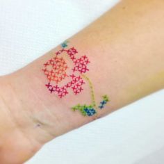 a person with a colorful tattoo on their arm