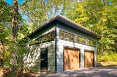 a garage in the middle of a wooded area