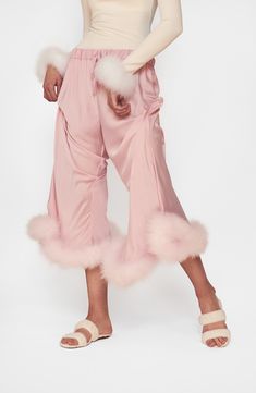 Detachable marabou feathers bring glam energy to these pajama pants so cute you can wear them in public, yet still comfy enough to lounge in. 100% Lenzing™ EcoVero™ viscose with turkey marabou feather trim Lenzing EcoVero viscose is a sustainably produced fiber using pulp made from renewable wood sources and certified with the EU Ecolabel for high environmental standards, including lower emissions and water impact than generic viscose Dry clean Made in Turkey This product meets Nordstrom Sustain Armani Suits, Satin Trousers, Pink Pajamas, Pajamas Comfy, Feather Trim, Silk Trousers, Ballroom Dress, Flare Trousers, Wardrobe Basics