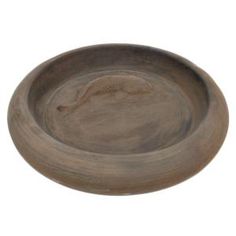 a wooden bowl with a fish on the bottom and a long tail sticking out of it