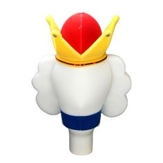 a white and yellow toy with a red ball on it's back, sitting in front of a white background