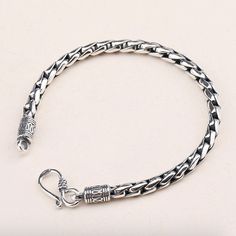 Product Details Metal Type: 925 Sterling Silver Gender: For Men Chain Width: 5mm Thickness: 5mm Length: 19cm / 20cm / 21cm / 22cm Weight: 20g (19cm) Size Instructions Please add 2cm or 0.8" to your net wrist size, or simply follow the chart below. Your Wrist Size Please Choose 6.5" 7.5" 7" 7.9" 7.5" 8.3" 8" 8.7" 17cm 19cm 18cm 20cm 19cm 21cm 20cm 22cm Silver Stainless Steel Cuban Link Bracelet, Silver Cuban Link Stainless Steel Bracelet, Silver Polished Cuban Link Bracelet, Elegant Silver Cuban Link Bracelet, Tarnish Resistant, Silver Cuban Link Bracelet, Tarnish Resistant For Everyday, Mens Silver Jewelry, Silver Chain For Men, Mens Silver Necklace, Mens Bracelet Silver