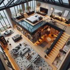 an aerial view of a living room, dining area and bedroom from the top floor