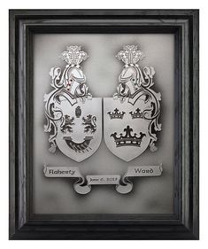 two coats of arms are framed in a wooden frame on a gray background with an inscription underneath it