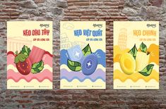 three posters on a brick wall with fruit in the middle and words,'need we out? '