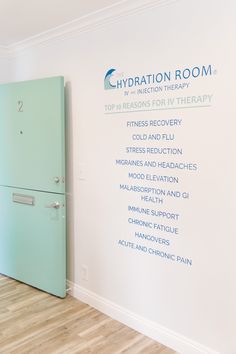 a room with a green refrigerator next to a wall that says hydration room on it