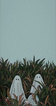 two white ghost like figures peeking out from the grass