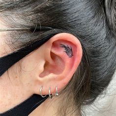 a person with ear piercings on their ears