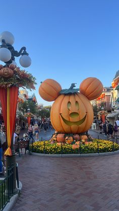 the entrance to mickey mouse's pumpkin patch at disneyland world is decorated for halloween