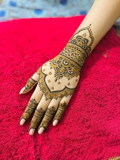 henna tattoo on the palm of a woman's hand