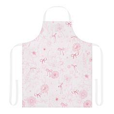 an apron with pink flowers and bows on the front, is shown against a white background