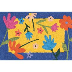 a rug with flowers and leaves on the front, blue backgroung background