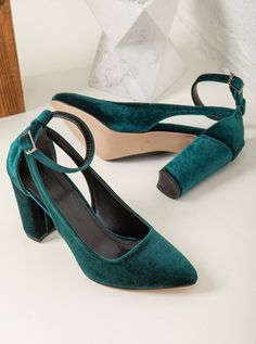 With a comfortable heel height of, these Green Velvet Shoes will keep you dancing all night long without sacrificing style or comfort. Crafted from high-quality green velvet, these emerald green bride shoes are stylish and comfortable.  These shoes are designed to fit true to size, so we recommend ordering your regular size. Velvet. To protect your shoes from dampness, apply a waterproof spray when they're new. For cleaning, use a mild soap solution and wipe the surface with a damp cloth that has been wrung out. Chic Green Block Heels With Round Toe, Green Almond Toe Court Shoes With 4-inch Heel, Green High Heel Evening Heels, Green Wrapped Heel Evening Heels, Green Evening Heels With Wrapped Heel, Evening Green Heels With Wrapped Heel, Green High Heels For Evening, Green Low Heels With Padded Heel, Green Low Heel Heels With Padded Heel