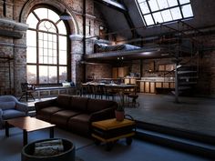 a living room filled with furniture next to a large open floor plan and high ceilings