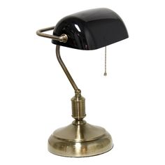 a black and gold desk lamp on a white background