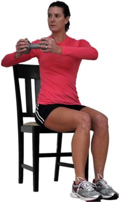 a woman is sitting on a chair with her legs crossed