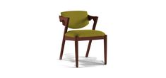 a wooden chair with green fabric upholstered on the back and armrests