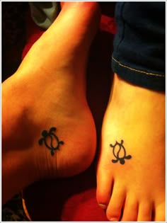 two people with tattoos on their feet and one has a turtle tattoo on the foot