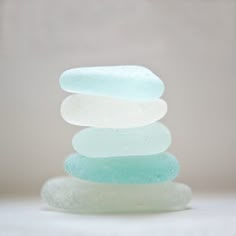 a stack of soap bars sitting on top of each other in front of a white background