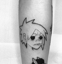 a black and white photo of a cartoon character on the leg