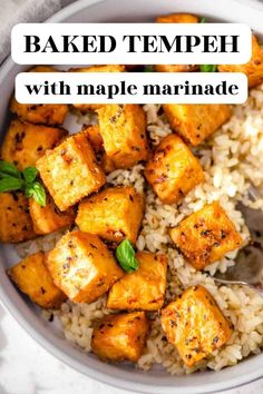 baked tempeh with maple marinade in a white bowl on top of rice