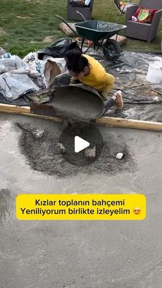 a man digging in the ground with a wheelbarrow