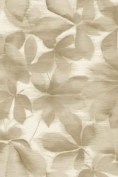 a beige background with leaves on it