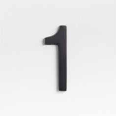 the number one is black against a white background and it appears to be made out of metal