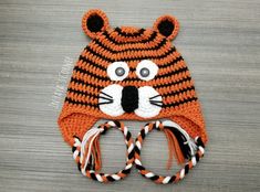 a crocheted hat with a tiger face on it